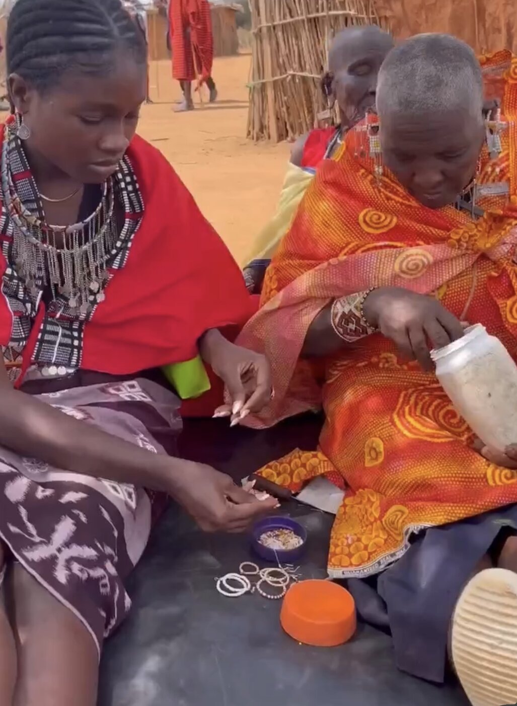 Maasai women making traditional beadwork at the boma