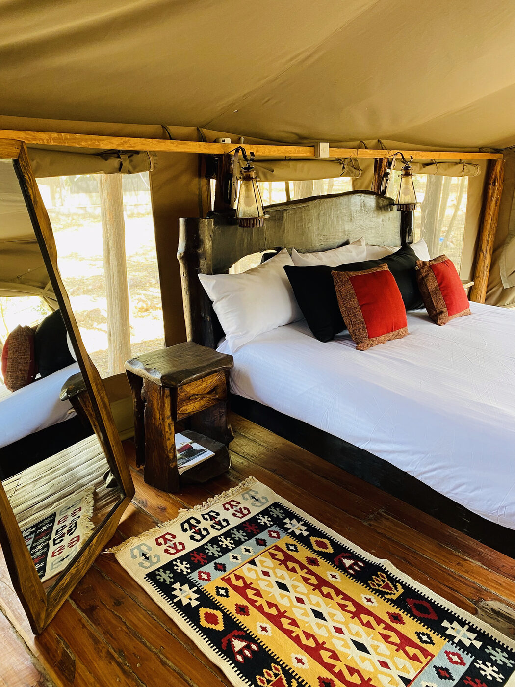 Glamping tent interior with kilim rug